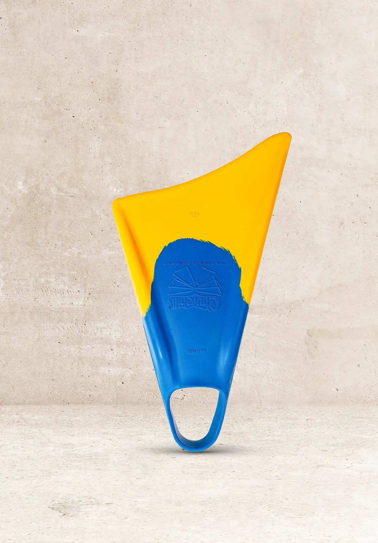 Blue and yellow Churchill swim fins against concrete background, original design for water sports
