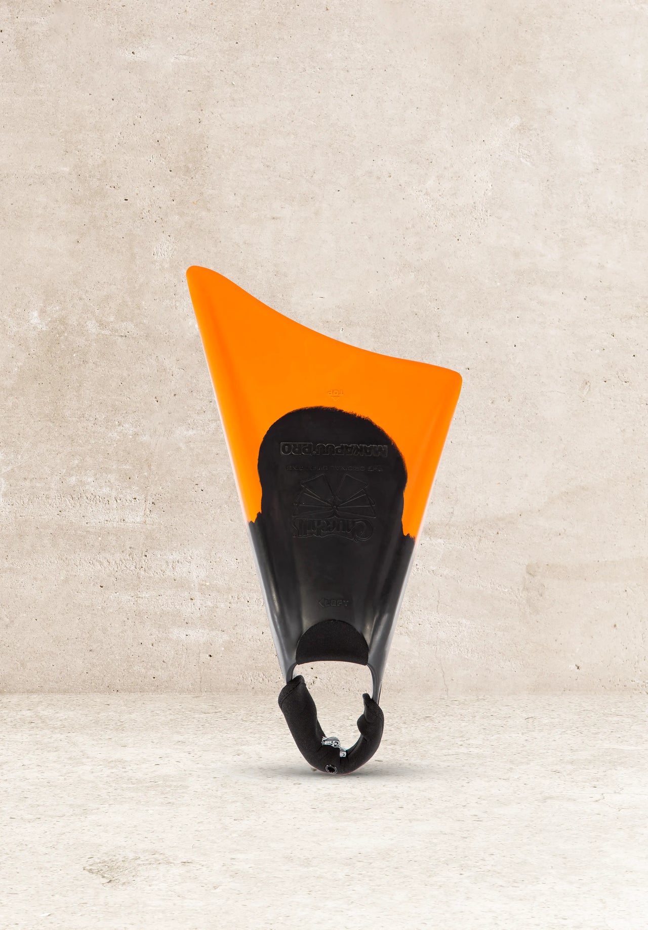 Churchill Makapuu Pro swim fins, black and orange, against concrete background