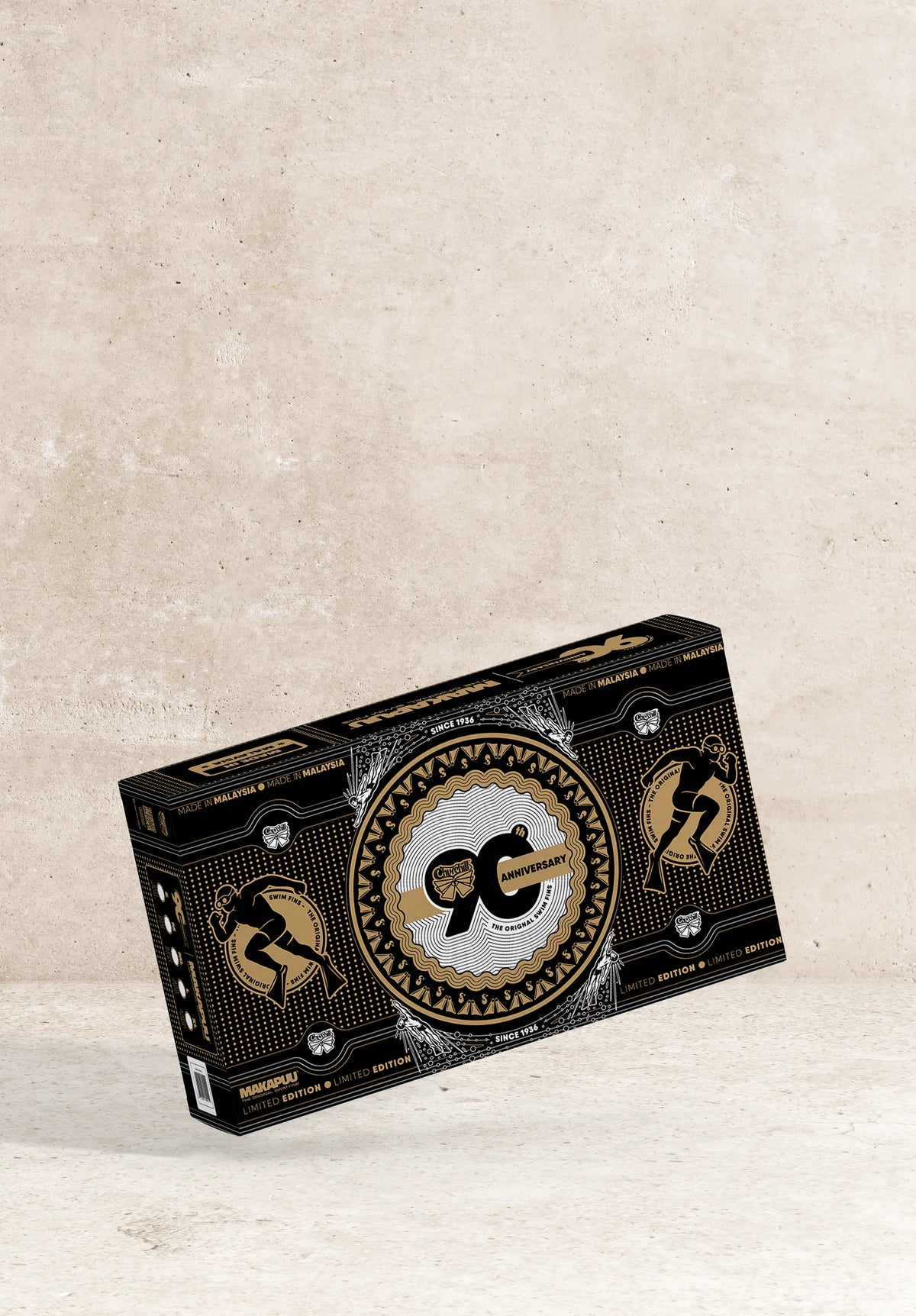 Black Makapulu 90th Anniversary limited edition packaging with gold graphic designs.