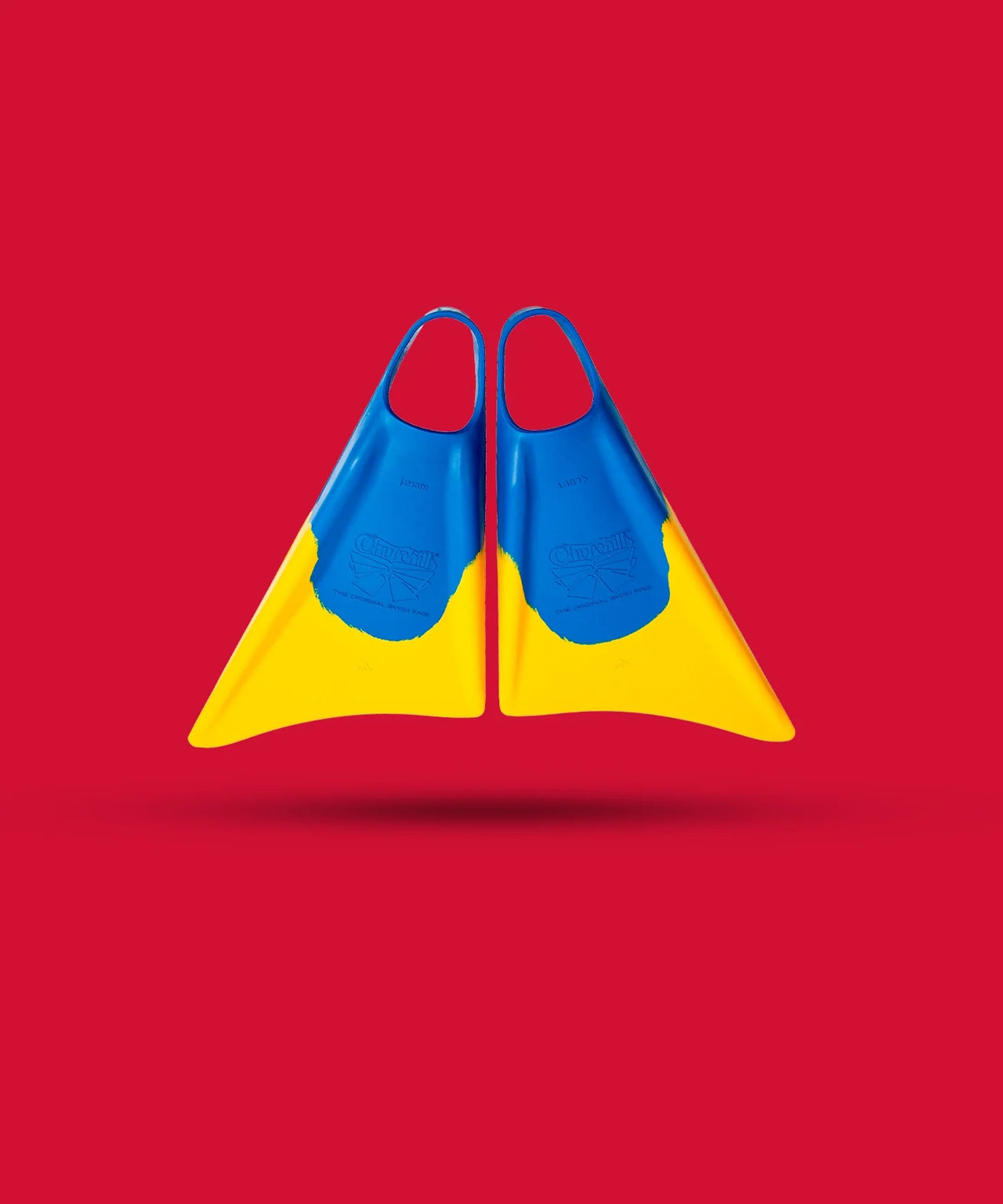 Blue and yellow Churchill swim fins on red background, classic boogie board gear